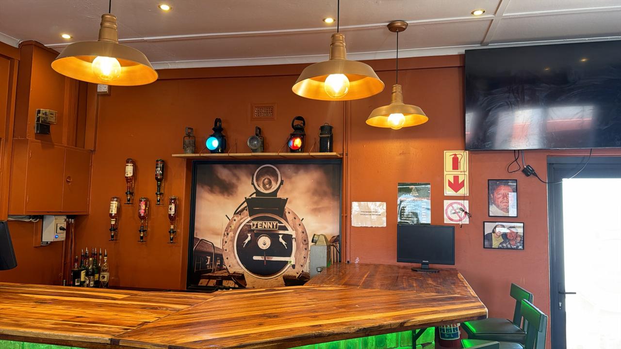 Die Stasie bar interior with golden pendant lights