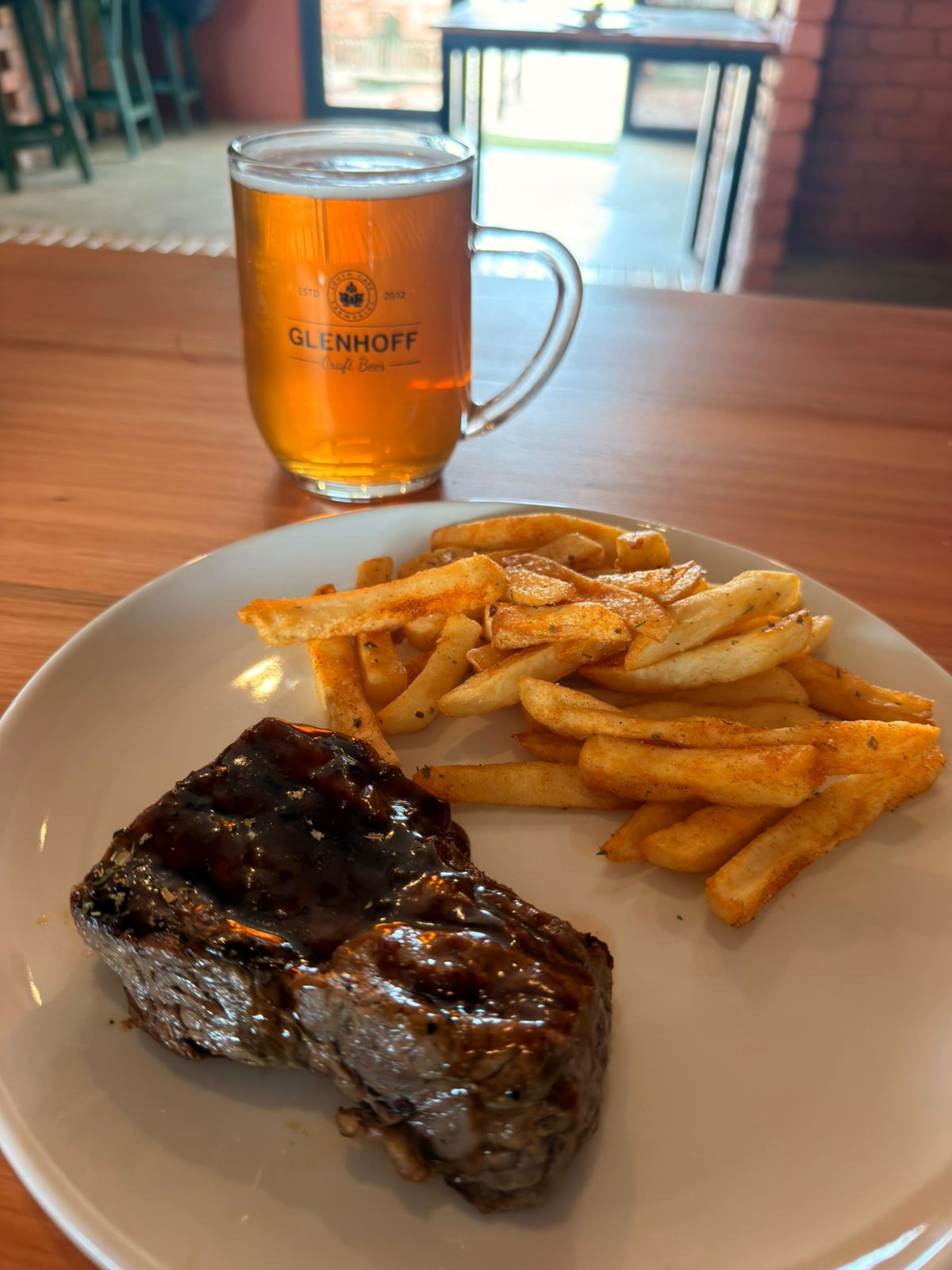 Grilled steak with chips and Glenhoff craft beer